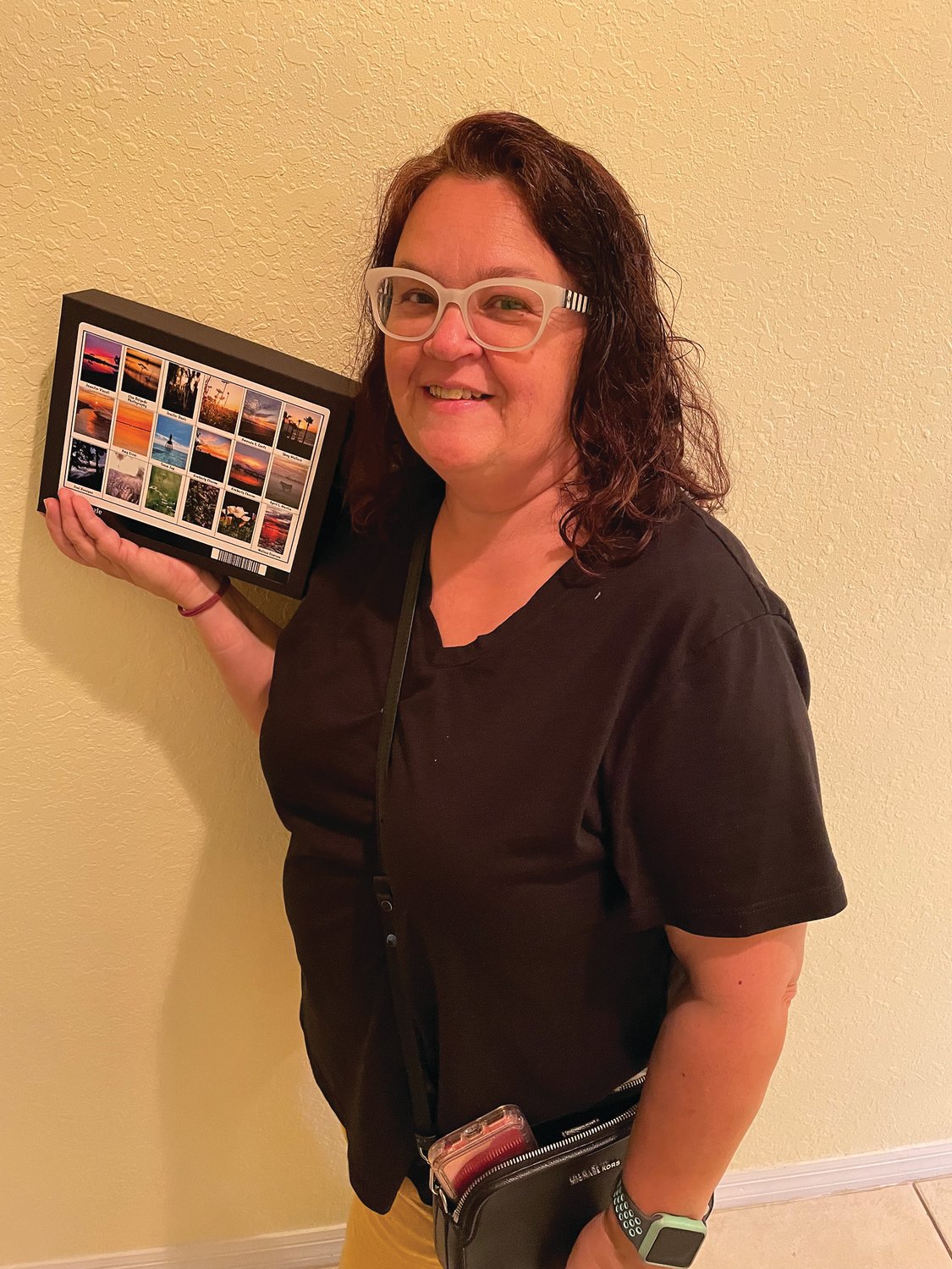 April L. Martin displays the puzzle with her photo on it.